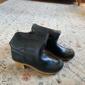 Black leather clog boots. Mid height